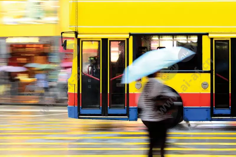 bus_flying_yellow_city_umbrella_blurry_1912_2600x1950.jpg.webp