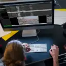 a man in front of a computer screen