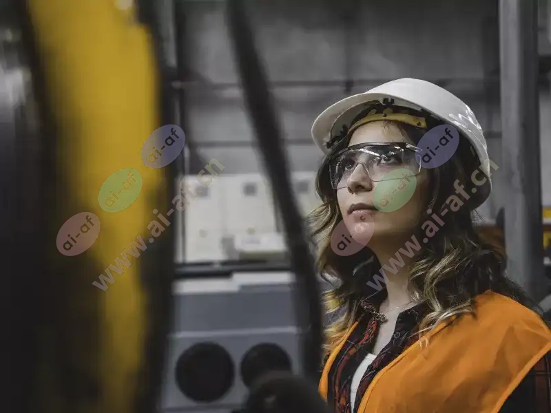 woman_industrial_setting_orange_vest_2209_hi.jpg.webp